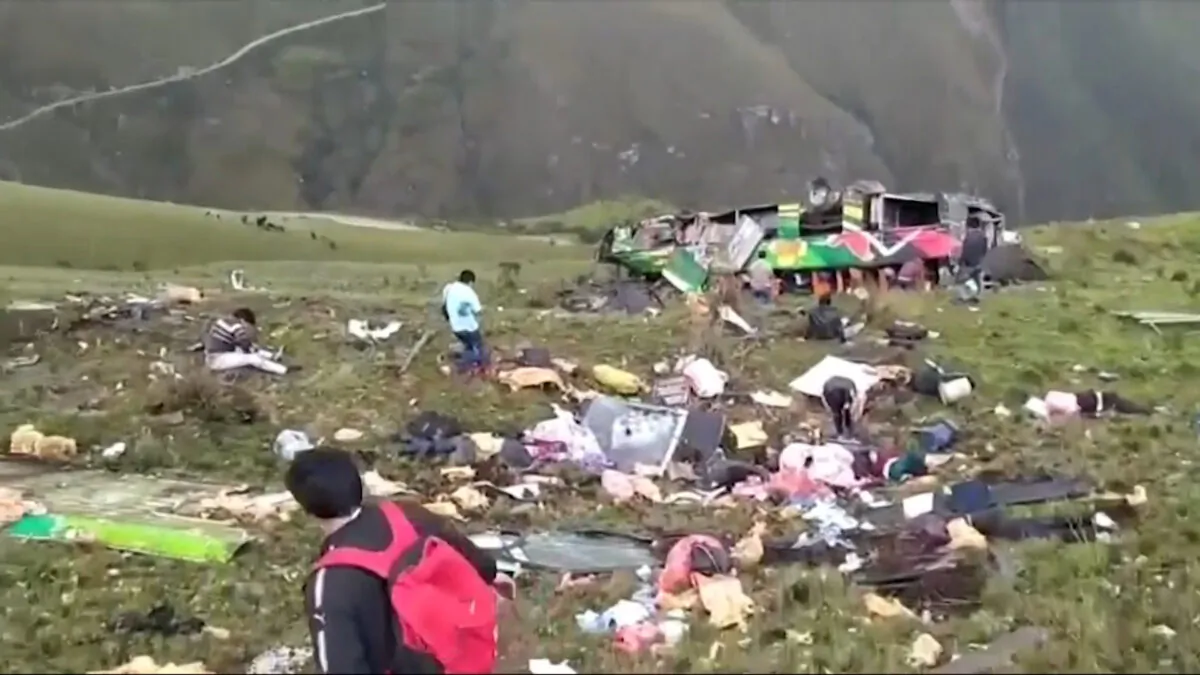 Wreckage of a bus after it fell into a ravine in the province of Pataz, Tayabamba, Peru, on Feb. 9, 2022, in a still from a video. (Ozone Television/AP/Screenshot via The Epoch Times)
