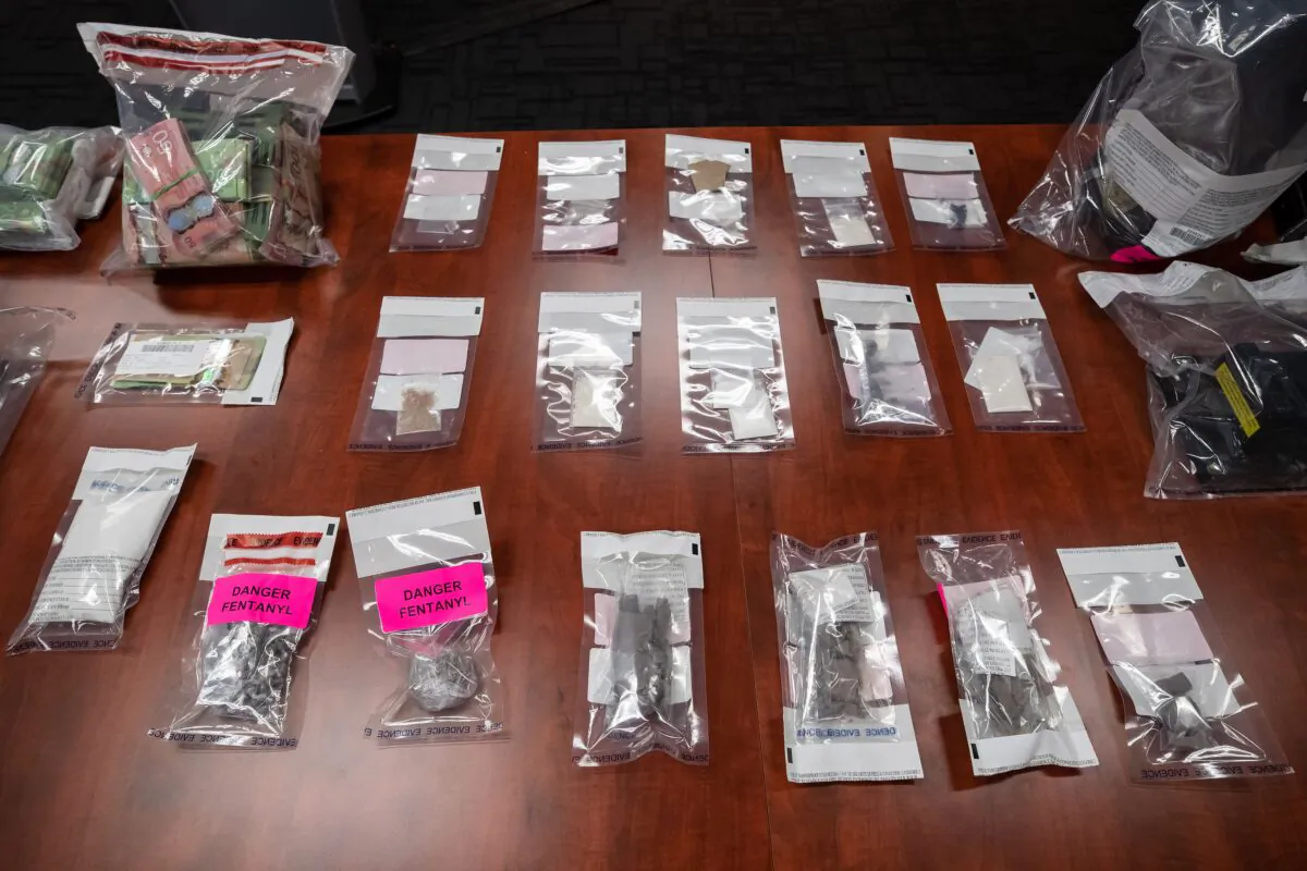 A seizure of illegal drugs and cash is displayed during a news conference at Surrey RCMP Headquarters, in Surrey, B.C,, on Sep. 3, 2020. (The Canadian Press/Darryl Dyck)