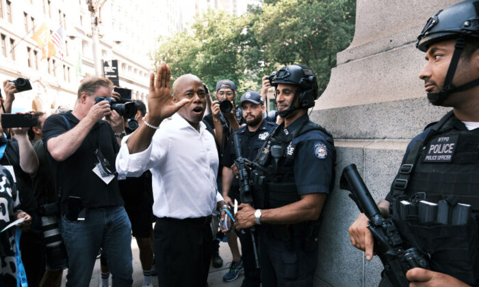 New York City Democratic mayoral nominee Eric Adams joins hundreds of police, fire, hospital, and other first responders in a ticker-tape parade along the Canyon of Heroes to honor the essential workers who helped navigate New York through COVID-19 on July 7, 2021. (Spencer Platt/Getty Images)