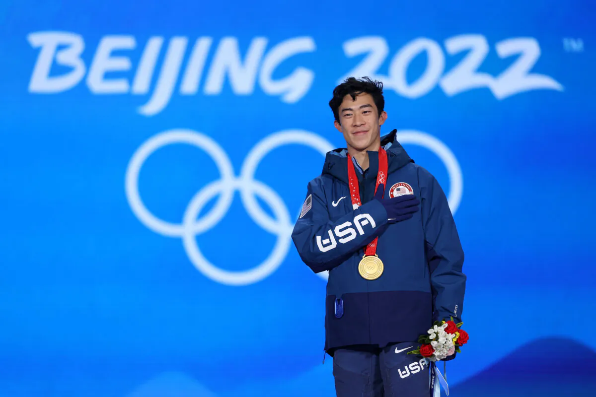 Gold medallist, Nathan Chen of Team USA, celebrates during the Figure Skating Men Single Skating medal ceremony on Day 6 of the Beijing 2022 Winter Olympic Games at Beijing Medal Plaza in Beijing, on Feb. 10, 2022. (Richard Heathcote/Getty Images)