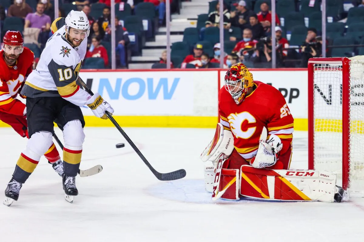 Calgary Flames goaltender Jacob Markstrom (25) makes a save as Vegas Golden Knights center Nicolas Roy (10) tries to score during the second period at Scotiabank Saddledome, in Calgary, Alberta, Canada, on Feb. 9, 2022. (Sergei Belski/USA TODAY Sports via Field Level Media)
