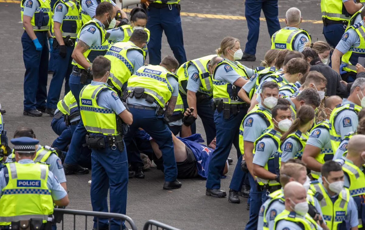 Police arrest people protesting against coronavirus mandates at Parliament in Wellington, New Zealand, on Feb. 10, 2022. (Mark Mitchell/NZ Herald via AP)
