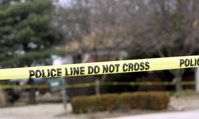 Police tape hangs across the street in this file photo. (Larry W. Smith/Getty Images)