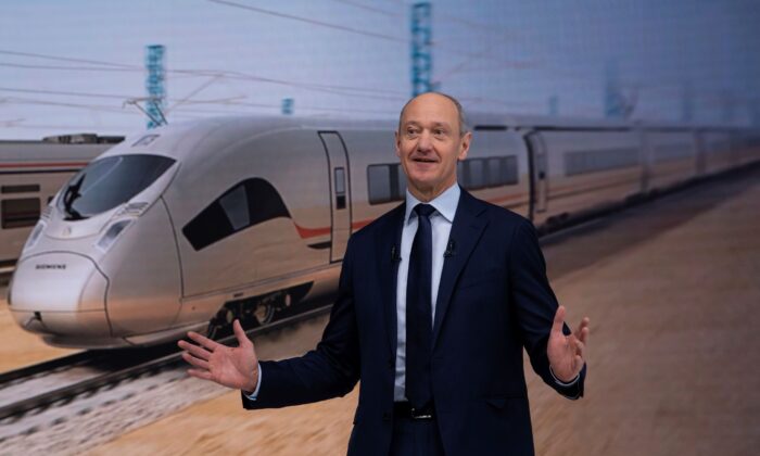 Roland Busch, President and CEO of Siemens AG talks on stage at the virtual Annual Shareholders' Meeting in Munich, Germany, on Feb. 10, 2022. (Sven Hoppe/Pool via AP)