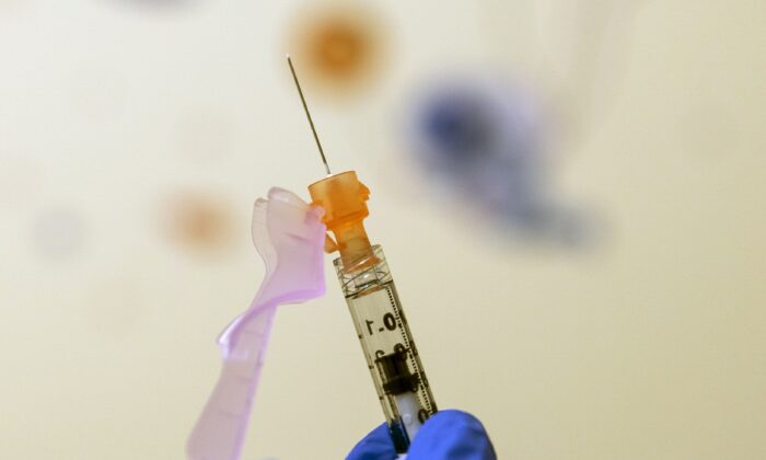 A nurse prepares a child's COVID-19 vaccine dose in Washington in a file image. (Carolyn Kaster/AP Photo)