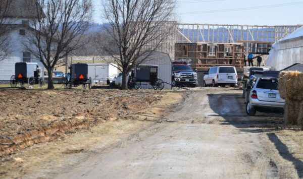 Amish neighbors pitch in to rebuild a barn that was destroyed by fire the previous day.
