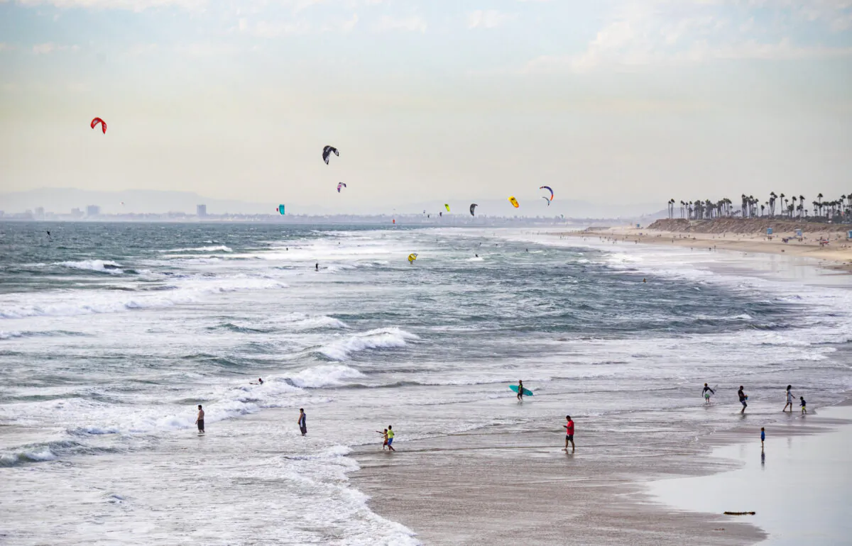 Beachgoers enjoy Huntington Beach, Calif., on Sept. 22, 2021. (John Fredricks/The Epoch Times)