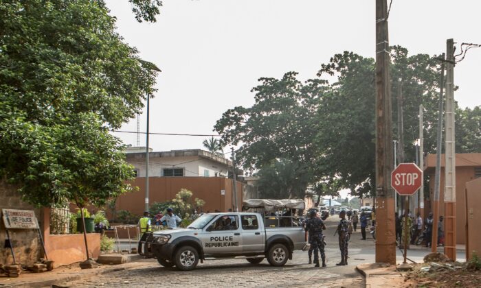 Police officers stand guard in Porto-novo, Benin, on Dec. 10, 2021. (Yanick Folly/AFP via Getty Images)