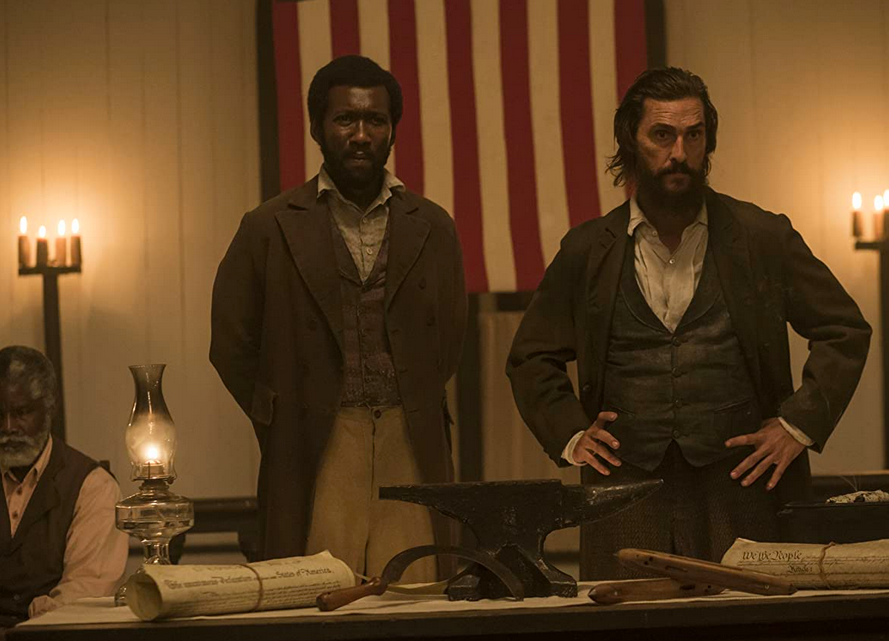 black man and white man in front of American flag in free state of jones