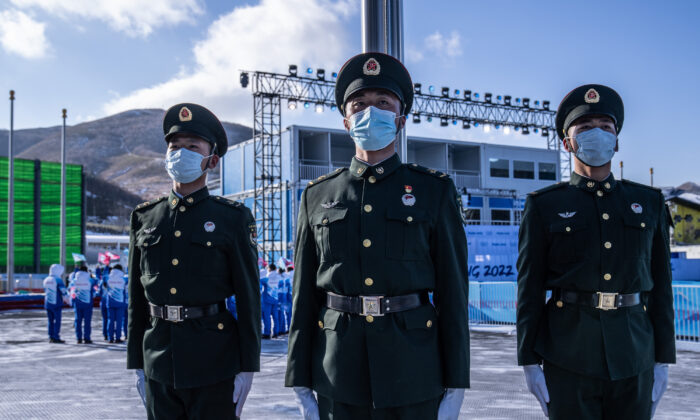 Peoples Liberation Army soldiers rehearse a flag raising drill at the medal plaza in Zhangjiakou Olympic village in Zhangjiakou, China, on Jan. 25, 2022. (Carl Court/Getty Images)