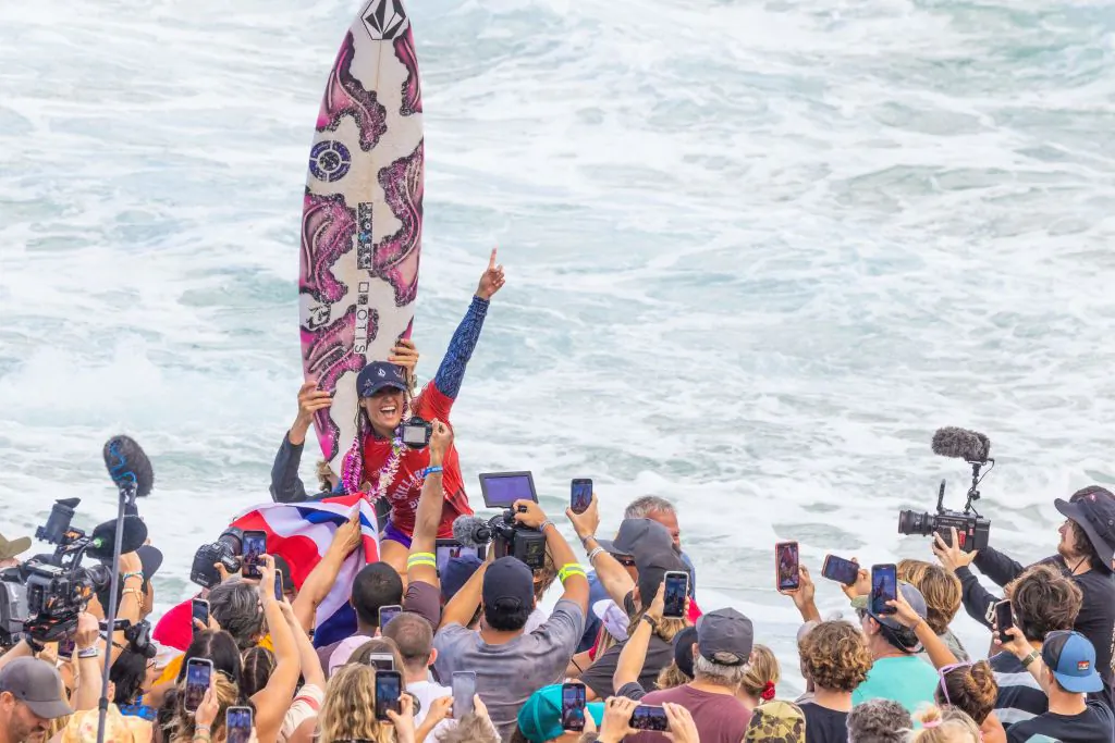 Hawaii's Moana Jones Wong gestures after winning the 2022 Women's Billabong Pipeline Pro at Banzai Pipeline on the north shore of Oahu, Hawaii, on February 6, 2022. (Photo by BRIAN BIELMANN/AFP via Getty Images)