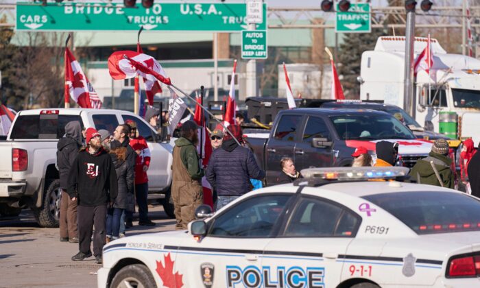 Protesters demonstrate against COVID-19 mandates and restrictions during a blockade of the Ambassador Bridge border crossing in Windsor, Ont., on Feb. 9, 2022. (Geoff Robins/AFP via Getty Images)