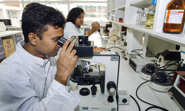 A file image of Indian scientists working in a laboratory for British Pharmaceutical company AstraZeneca PLC in Bangalore. (Indranil Mukherjee/AFP via Getty Images)