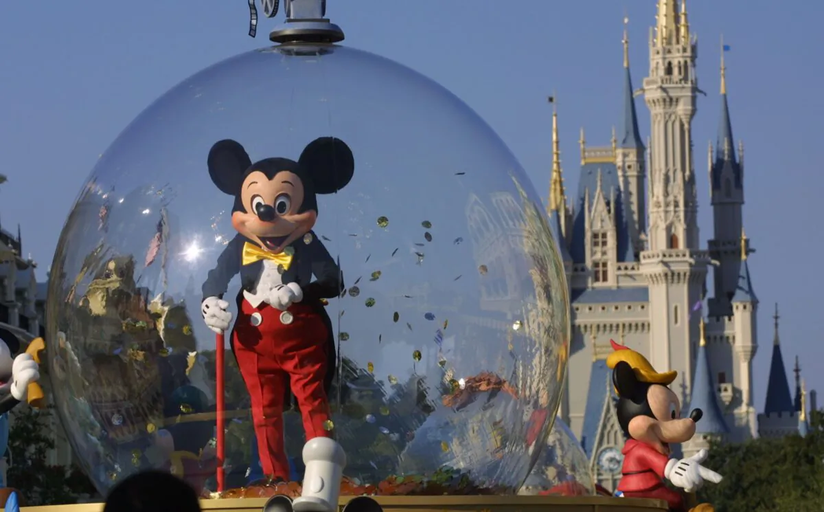 Mickey Mouse rides in a parade at Disney World's Magic Kingdom in Orlando, Fla., on Nov. 11, 2001. (Joe Raedle/Getty Images)