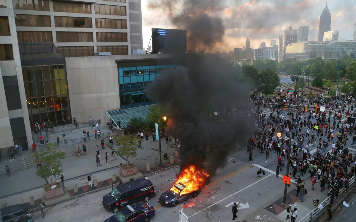 After a peaceful march of hundreds to the Georgia State Capitol in Atlanta on May 29, 2020, protesters returned to the area around the CNN Center and confronted police amid outrage over the death of George Floyd in Minneapolis. (Alyssa Pointer/Atlanta Journal Constitution/TNS)