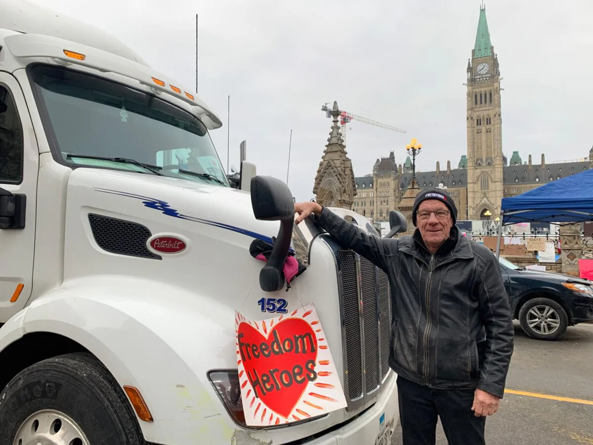 Trucker Bill Dykema, from Ontario, was one of the first protesters to park his rig in the center of Ottawa, Canada, in an undated photo. (Richard Moore/The Epoch Times)