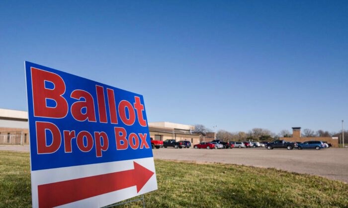 A sign pointing in the direction of a ballot drop boxes in Michigan on Nov. 3, 2020. (Seth Herald/AFP via Getty Images)