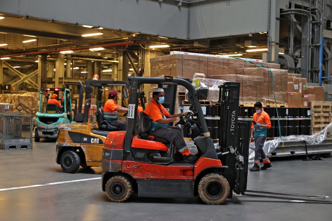 Workers move medical supplies in Doha, Qatar in a file photograph. (Karim Jaafar/AFP via Getty Images)