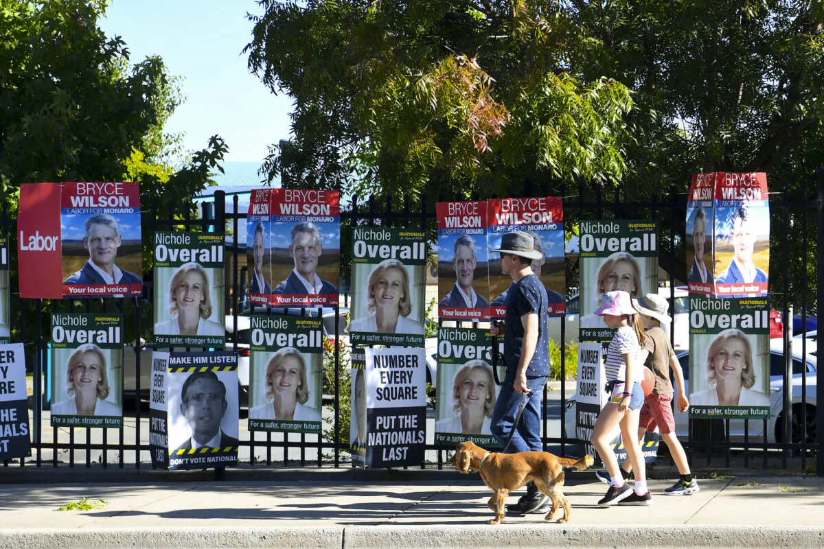 Members of the public arrive to casts their votes at Jerrabomberra public school in Jerrabomberra, Australia, on Feb. 12, 2022. (AAP Image/Lukas Coch) 