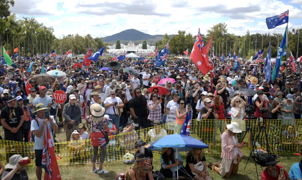 Protesters against vaccine mandates gather on the lawn of Parliament House in Canberra, Australia, on Feb. 12, 2022. (Tracey Nearmy/Getty Images)