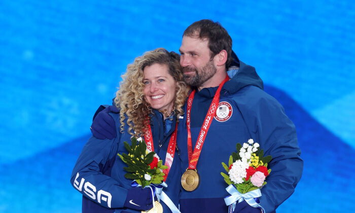 Gold medallists Lindsey Jacobellis and Nick Baumgartner of Team United States pose with their medals during the Mixed Team Snowboard Cross medal ceremony on Day 8 of the Beijing 2022 Winter Olympic Games at Zhangjiakou Medal Plaza, in Zhangjiakou, China, on Feb. 12, 2022. (Ezra Shaw/Getty Images)