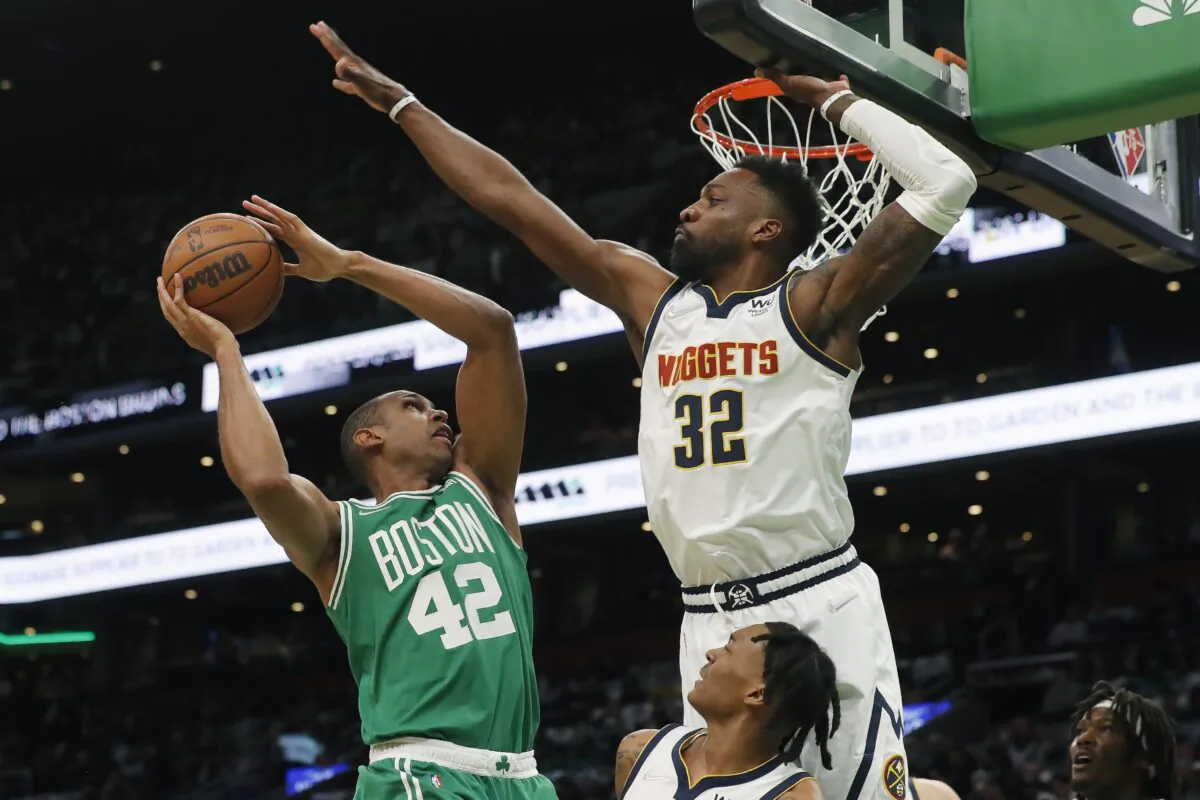 Boston Celtics' Al Horford (42) shoots against Denver Nuggets' Jeff Green (32) during the first half of an NBA basketball game in Boston, on Feb. 11, 2022. (Michael Dwyer/AP Photo)