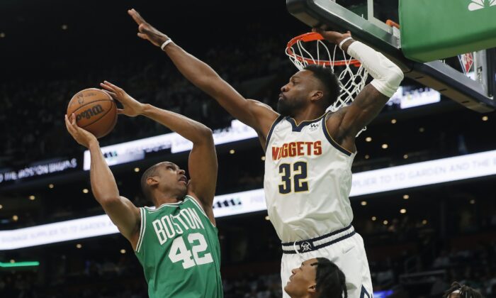Boston Celtics' Al Horford (42) shoots against Denver Nuggets' Jeff Green (32) during the first half of an NBA basketball game in Boston, on Feb. 11, 2022. (Michael Dwyer/AP Photo)