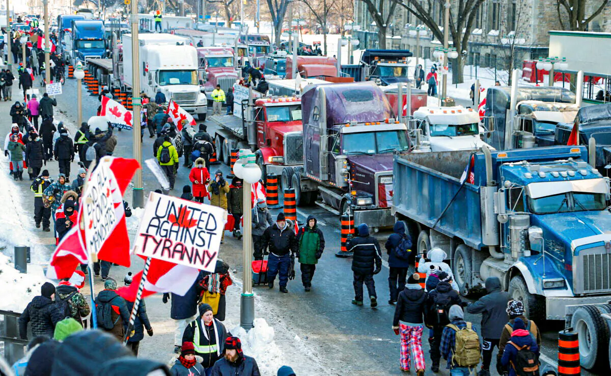 Trucks are parked on Wellington Street near the Parliament Buildings as truckers and supporters protest against COVID-19 mandates and restrictions in Ottawa on Jan. 29, 2022. (Patrick Doyle/Reuters)