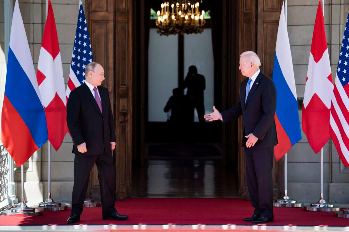 President Joe Biden prepares to shake hands with Russian President Vladimir Putin prior to the U.S.–Russia summit at the Villa La Grange, in Geneva, Switzerland, on June 16, 2021. (Brendan Smialowski/AFP) 