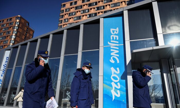 Security guards walk at the Beijing 2022 Winter Olympic Games village in Beijing on Dec. 24, 2021. (Jade Gao/AFP via Getty Images)