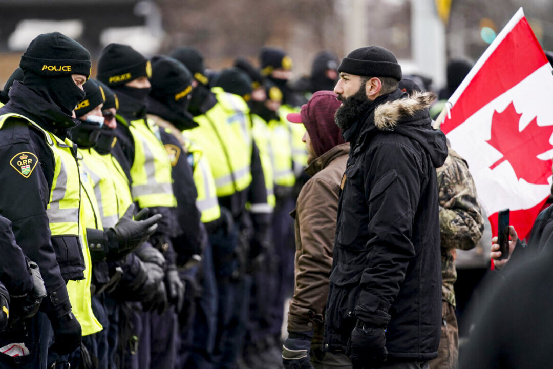 Police Move In to Clear Blockade at Canada-US Border Crossing Bridge in Windsor