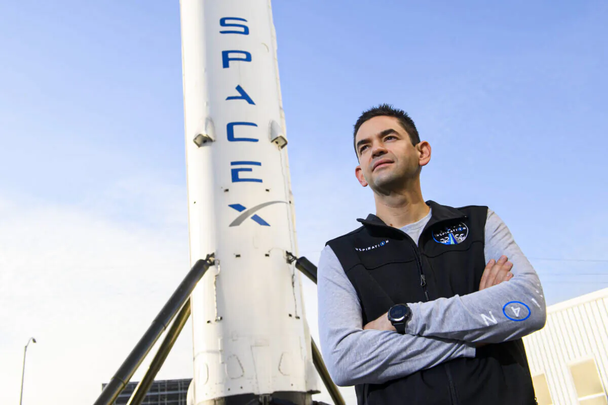 Jared Isaacman, founder and chief executive officer of Shift4 Payments, stands for a portrait in front of the recovered first stage of a Falcon 9 rocket at Space Exploration Technologies Corp. (SpaceX) in Hawthorne, Calif., on Feb. 2, 2021. (Patrick T. Fallon/AFP via Getty Images)