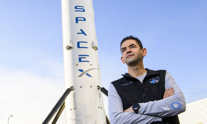 Jared Isaacman, founder and chief executive officer of Shift4 Payments, stands for a portrait in front of the recovered first stage of a Falcon 9 rocket at Space Exploration Technologies Corp. (SpaceX) in Hawthorne, Calif., on Feb. 2, 2021. (Patrick T. Fallon/AFP via Getty Images)