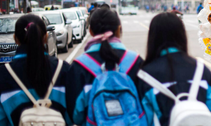 Chinese school girls walking together. (Johannes Eisele/AFP/Getty Images)
