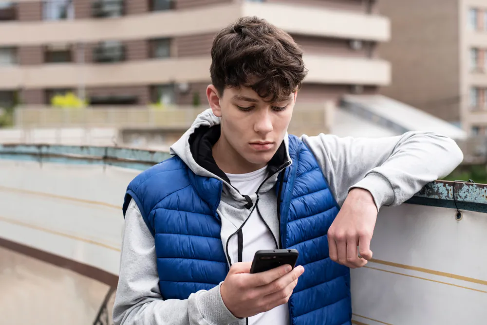 Smartphones offer too many distractions to teens, and can also disrupt home life. (Shutterstock)