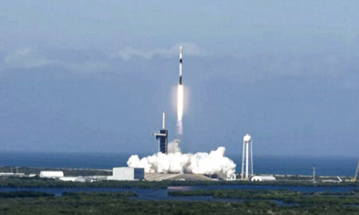 In a still from video, a Falcon 9 rocket carrying a batch of 49 Starlink satellites launches at the Kennedy Space Center in Cape Canaveral, Fla., on Jan. 3, 2022. (Screenshot/SpaceX via AP)