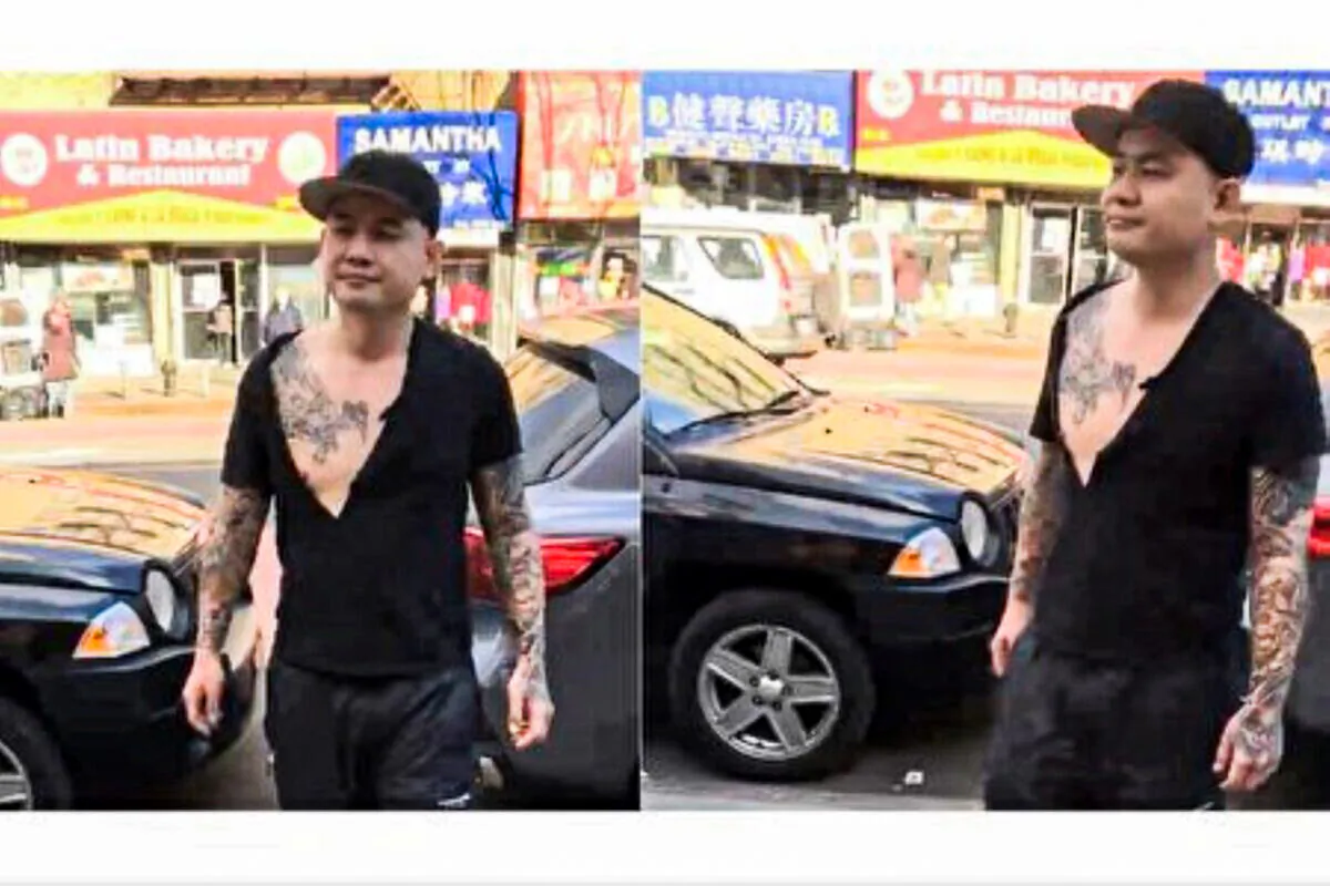 The tattooed suspect attacks two Falun Gong booths promoting the withdrawal from the CCP in Flushing, NYC, on Feb. 10, 2022. (Courtesy of Xu Weiguo)