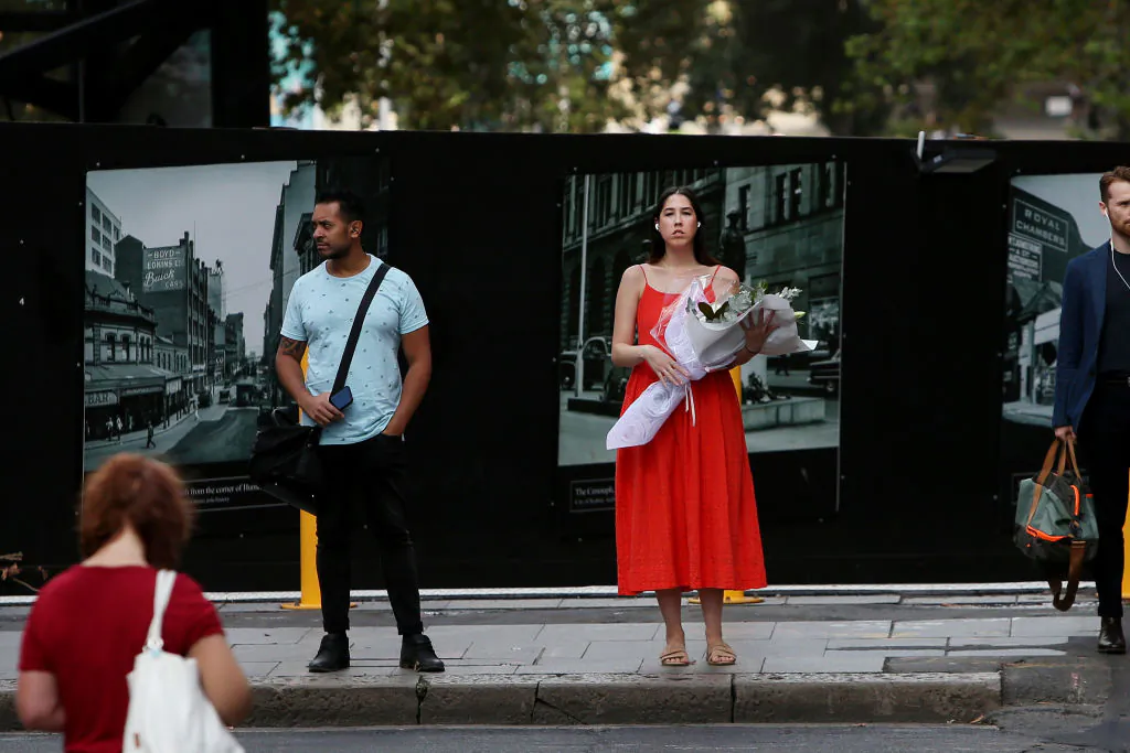 A woman is seen holding flowers as she makes her way through Martin Place during Valentines Day, in Sydney, Australia, on Feb. 14, 2020. (Lisa Maree Williams/Getty Images)