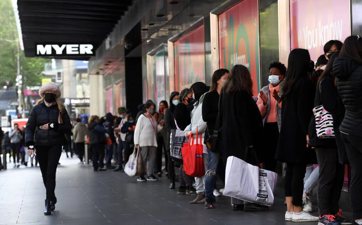 People queue outside a department store in Melbourne, Australia, on Oct. 29, 2021. (William West/AFP via Getty Images)