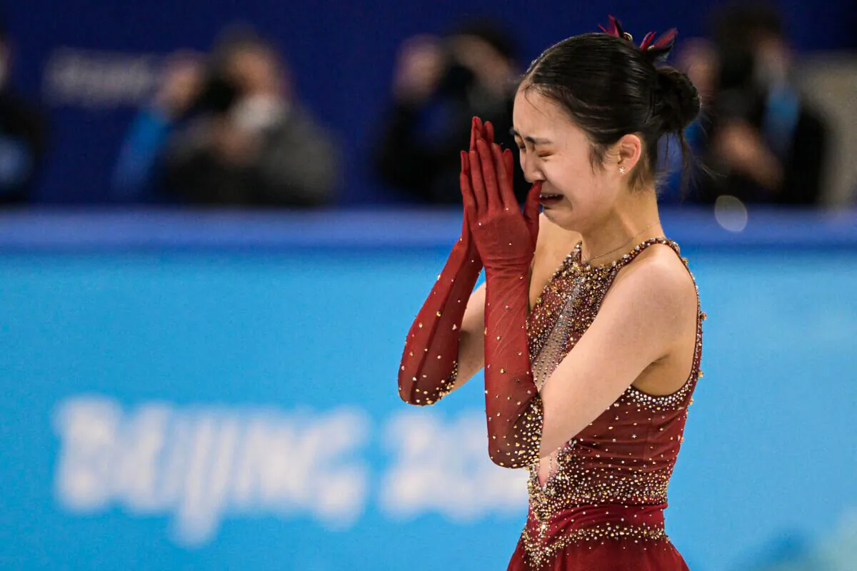 China's Zhu Yi cries after competing in the women's single skating free skating of the figure skating team event during the Beijing 2022 Winter Olympic Games at the Capital Indoor Stadium in Beijing on Feb. 7, 2022. (Sebastien Bozon/AFP via Getty Images)