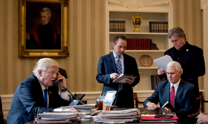 President Donald Trump speaks on the phone with Russian President Vladimir Putin in the Oval Office of the White House, on Jan. 28, 2017. (Drew Angerer/Getty Images)