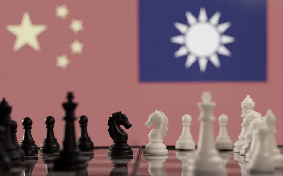 Chess pieces are seen in front of displayed China and Taiwan's flags in this illustration taken on Jan. 25, 2022. (Dado Ruvic/Illustration/Reuters)