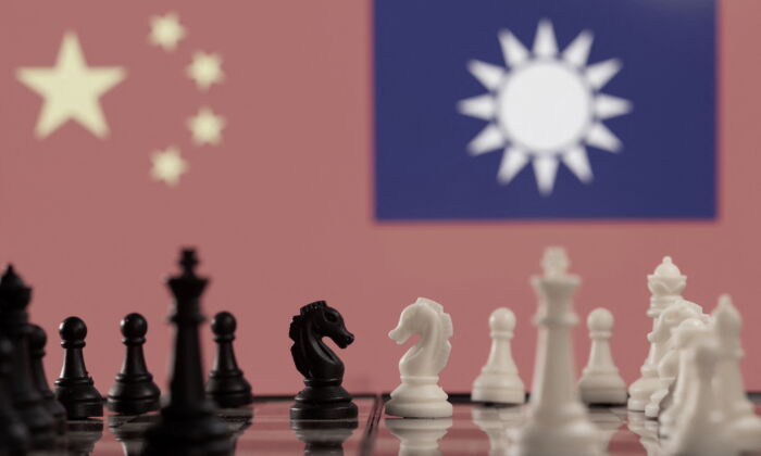 Chess pieces are seen in front of displayed China and Taiwan's flags in this illustrative photograph taken on Jan. 25, 2022. (Reuters/Dado Ruvic/Illustration)