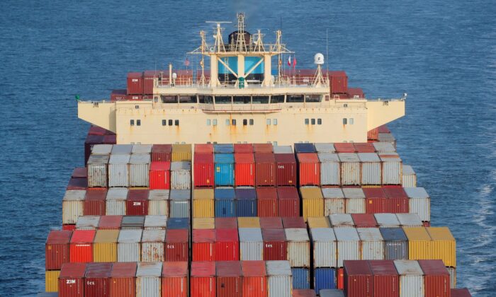 Containers are stacked on the deck of the cargo ship as it is underway in New York Harbor in New York City, on Nov. 7, 2021. (Brendan McDermid/Reuters)