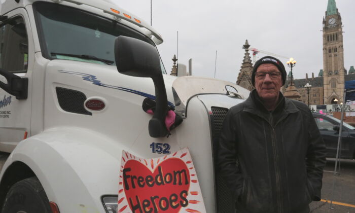 From Ontario, tracker Bill Dykema was one of the first protesters to park a rig in the heart of Ottawa. He says he is taking action for his 19 grandchildren.  (Richard Moore / The Epoch Times)