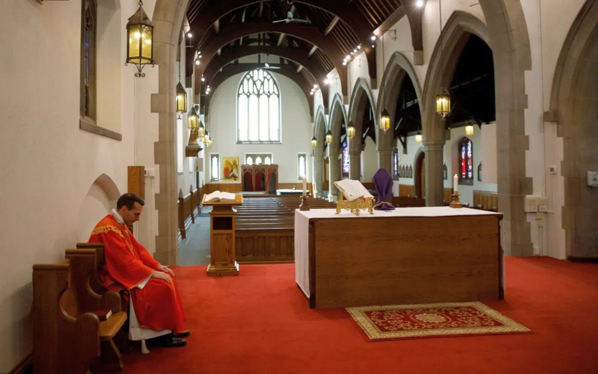Father Peter Turrone pauses as he leads a Palm Sunday mass to an empty church at the St. Thomas Aquinas Catholic Church in Toronto, Canada, on April 5, 2020. (Cole Burston/Getty Images)
