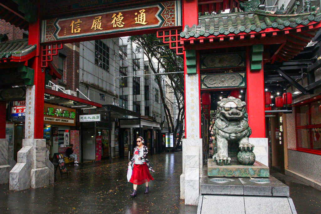 A woman walks through the Chinatown district arch on March 04, 2020 in Sydney, Australia. (Lisa Maree Williams/Getty Images)
