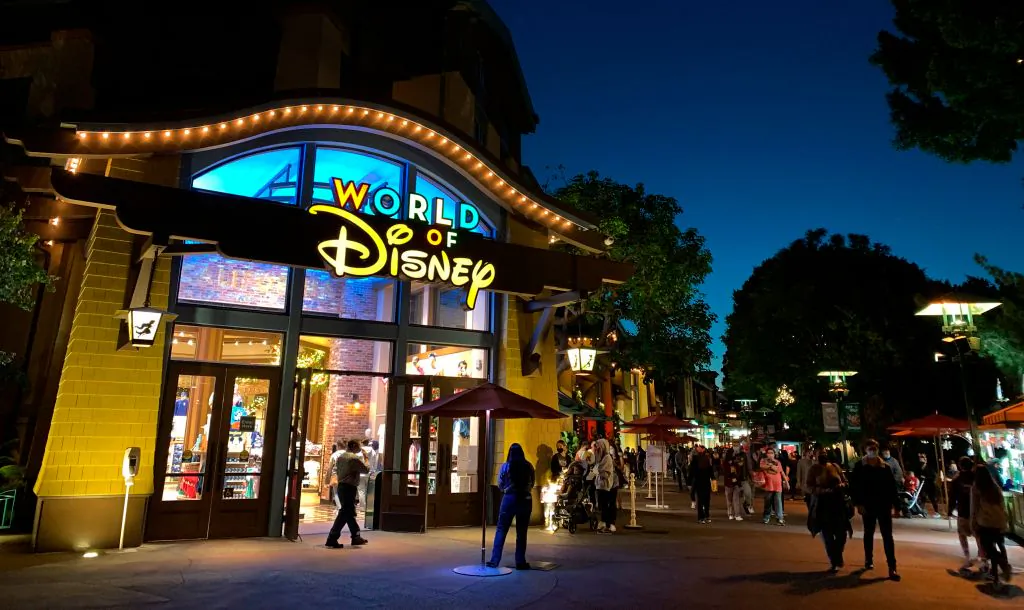 People wait in line to enter a store as people visit Disneyland, where parts of the park open for more retail and dining as an extension of the Downtown Disney District in Anaheim, Calif., on Nov. 19, 2020. (Frederic J. Brown/AFP via Getty Images)