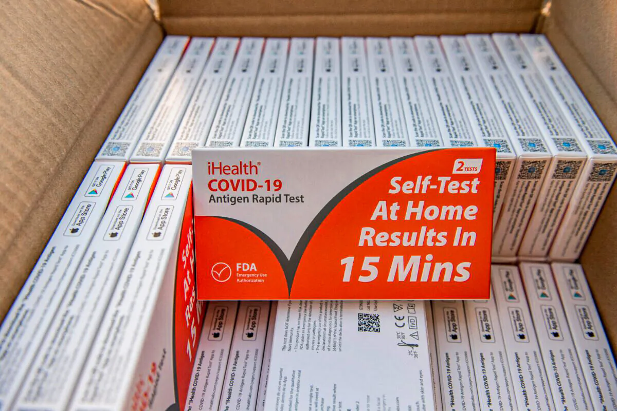 Rapid at-home Covid-19 test kits are ready to be distributed by the GreenRoots environmental protection organization and Chelsea Community Connections in Chelsea, Mass., on Dec. 17, 2021. (Joseph Prezioso/AFP via Getty Images)