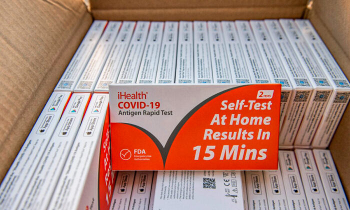 Rapid at-home Covid-19 test kits are ready to be distributed by the GreenRoots environmental protection organization and Chelsea Community Connections in Chelsea, Mass., on Dec. 17, 2021. (Joseph Prezioso/AFP via Getty Images)